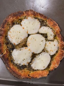 Let all ingredients thaw to room temperature. Brush the crust rim generously with olive oil, top with your choice of pesto and sliced mozzarella cheese. Season generously to taste